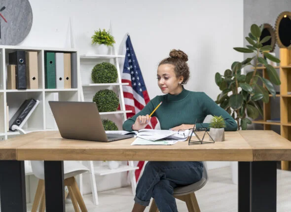 medium-shot-girl-studying-desk-indoors