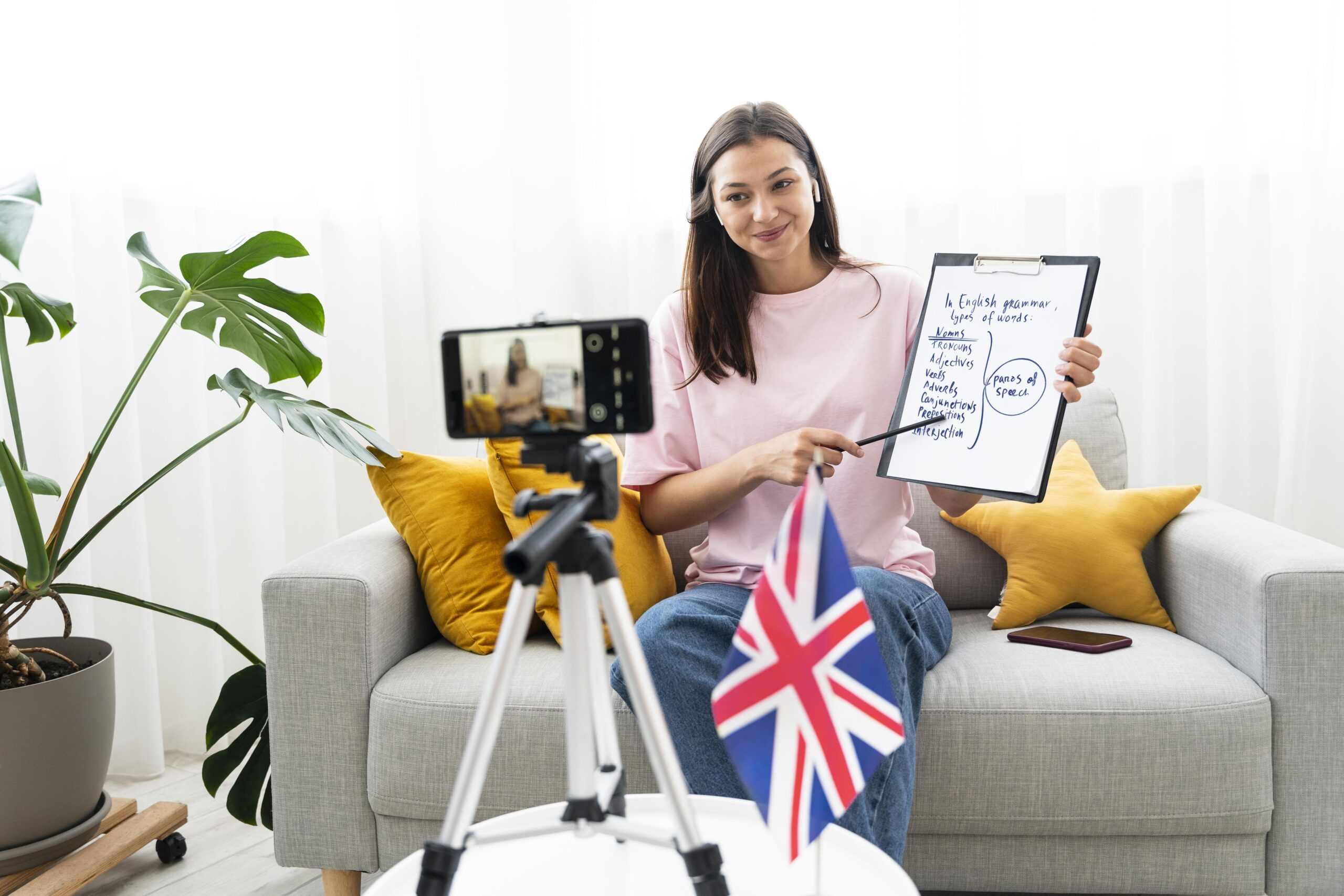 How Do I Improve My English in the UK for International Students? young woman teaching english lessons online scaled